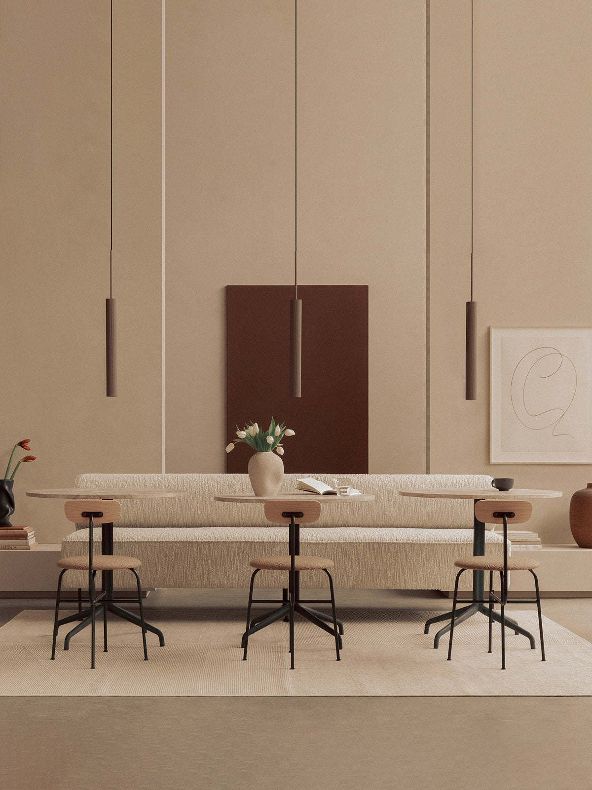 Minimalist beige dining area with textured bench, round light wood tables, black
