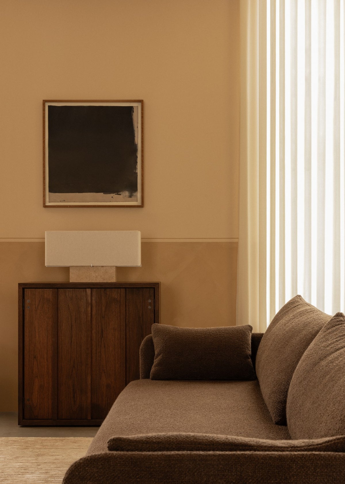 Minimal beige living room with brown textured sofa, wooden cabinet, rectangular