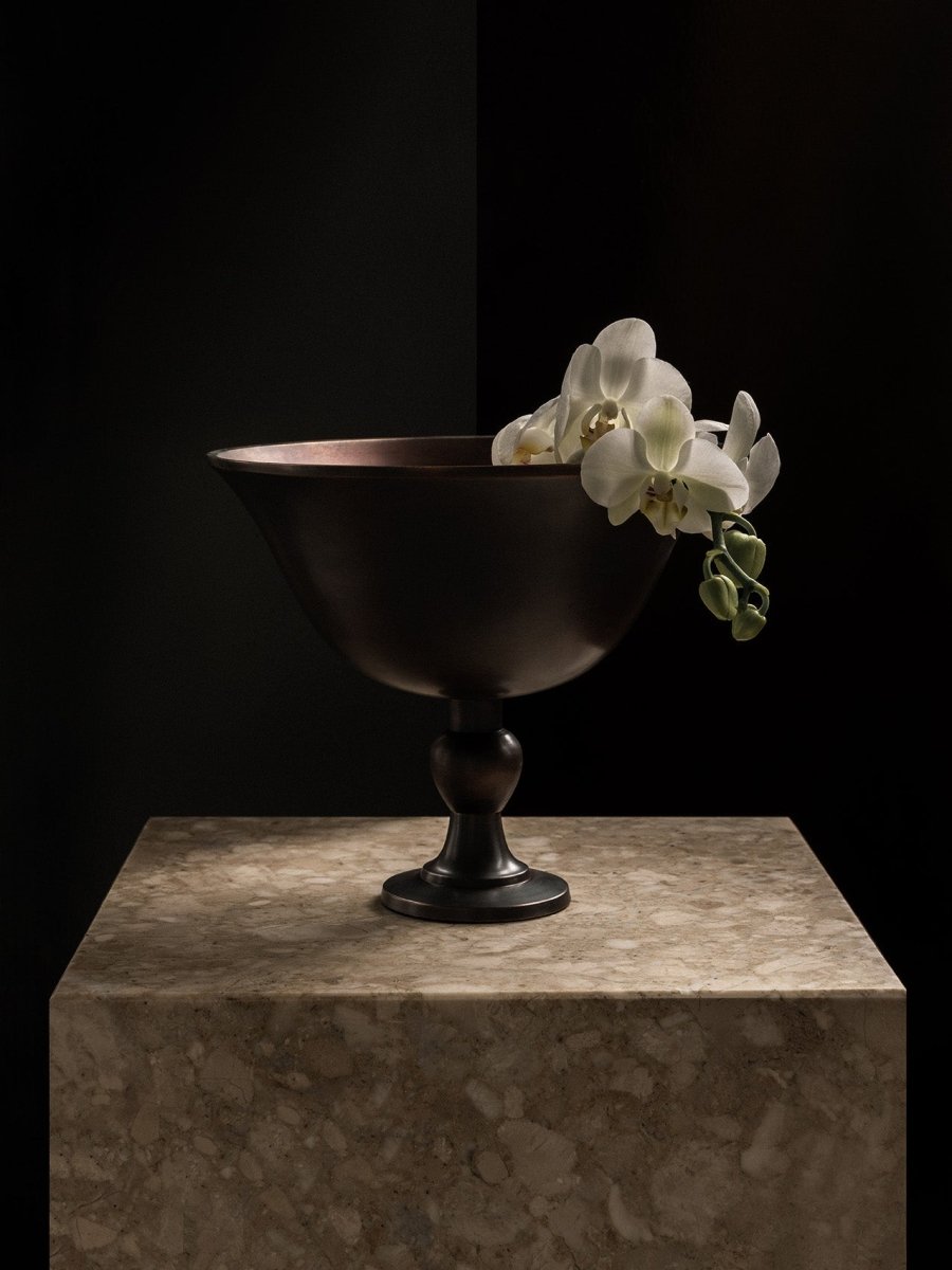 The Audo Pavot Bowl in a dark bronze finish, displayed on a