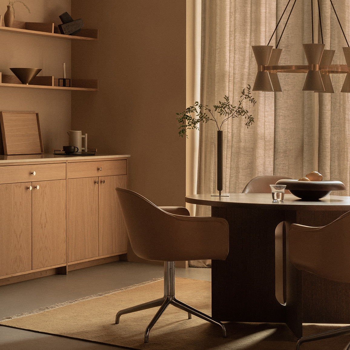 Upholstered dining chairs with metal swivel bases surrounding a wooden dining ta