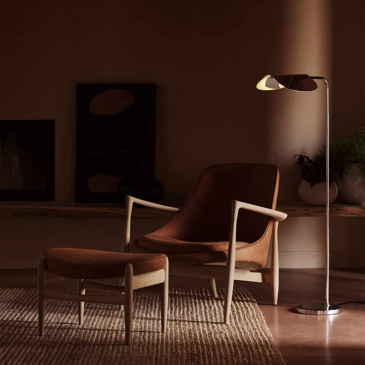 Sleek metal floor lamp with an adjustable shade standing beside a modern
