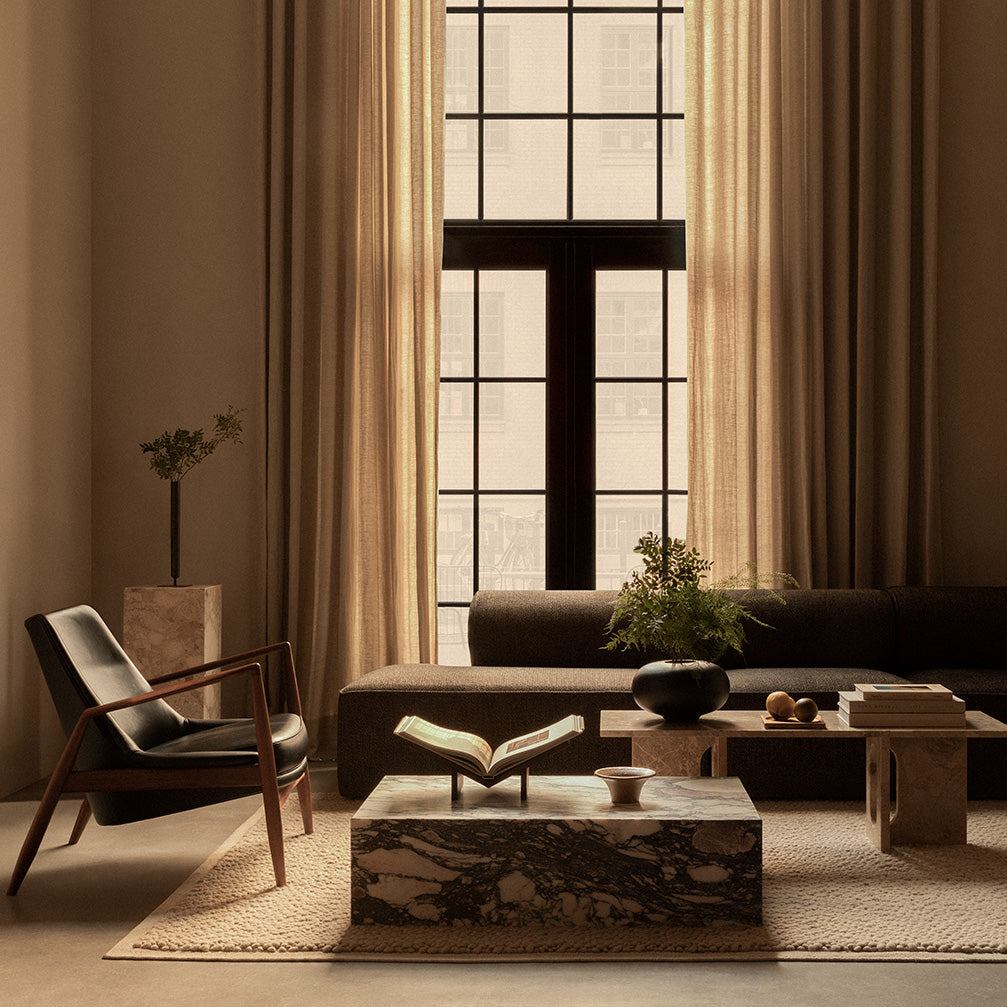 Marble coffee tables with natural veining in a sophisticated living room styled