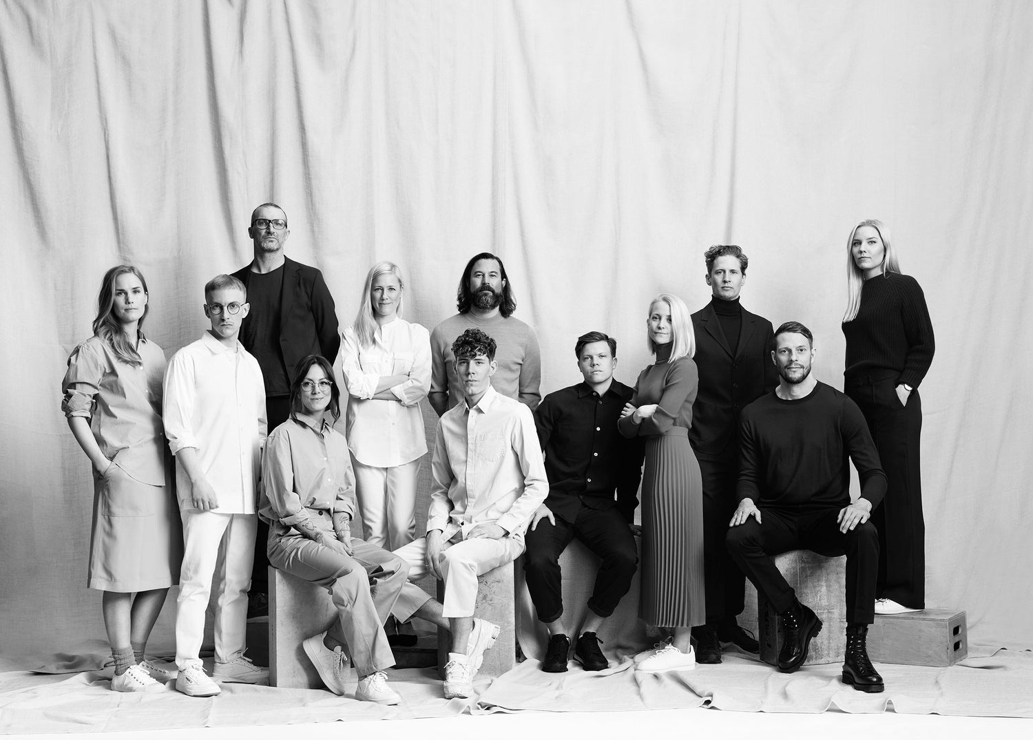 Black and white portrait of the Note Design Studio team members posing