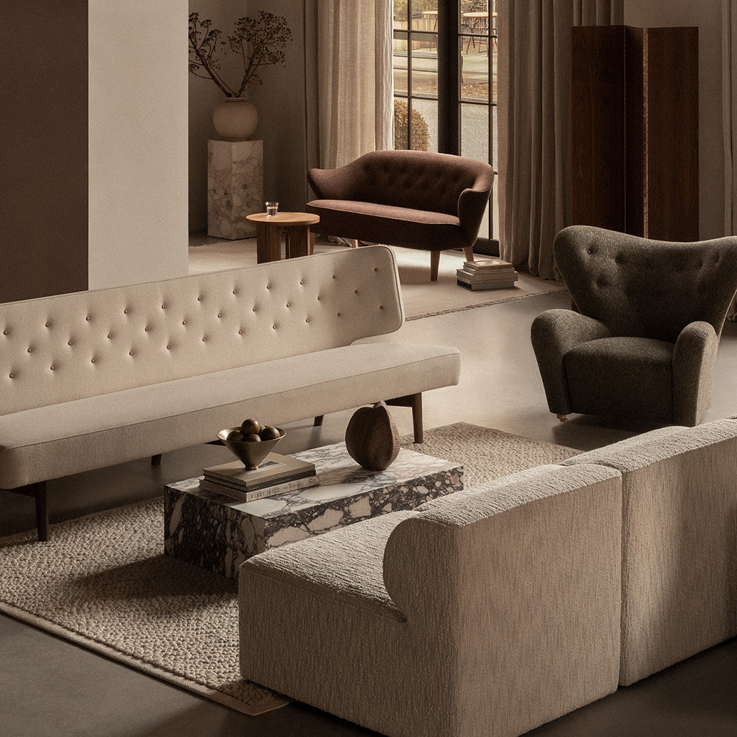 Eileen Gray Day Bed and other designer furniture in a warm, minimalist