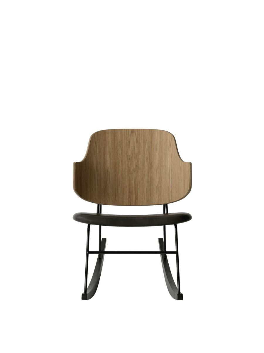 Front view of The Penguin Rocking Chair with a natural oak back, black leather seat, and black steel frame on ash rockers.