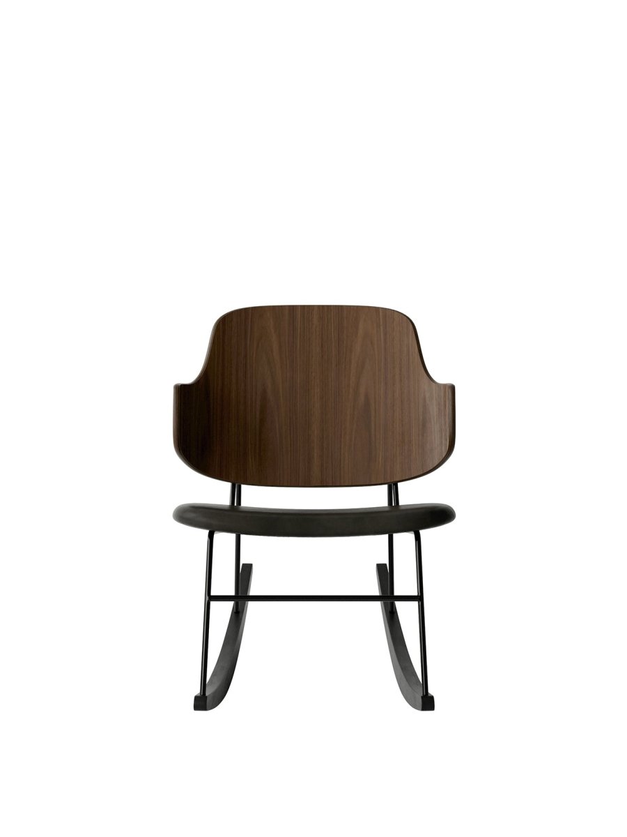 The Penguin Rocking Chair shown from the front with walnut veneer back, Dakar leather seat, and black steel rocking frame.