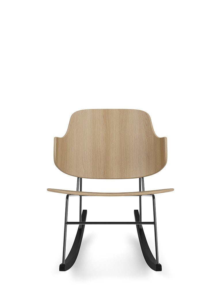 Front view of The Penguin Rocking Chair featuring a natural oak seat and backrest on a black steel rocking frame.