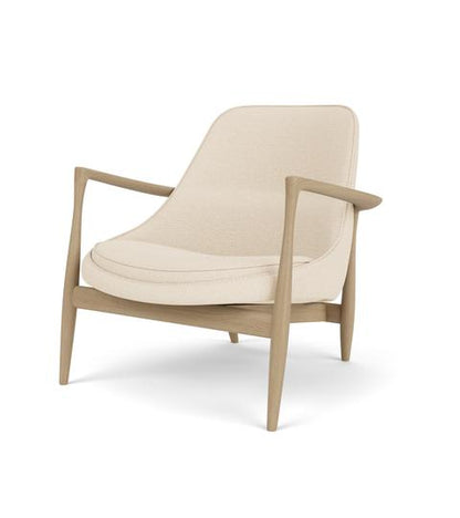 3/4 angle view of the Elizabeth Lounge Chair featuring a natural oak frame and light cream Logan Jasmine fabric upholstery.