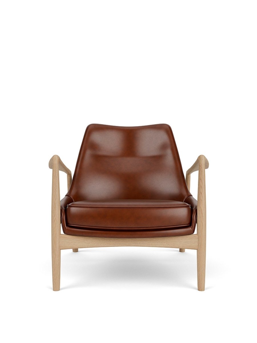 Front view of The Seal Lounge Chair, Low Back, featuring a natural oak frame and brown leather upholstery.