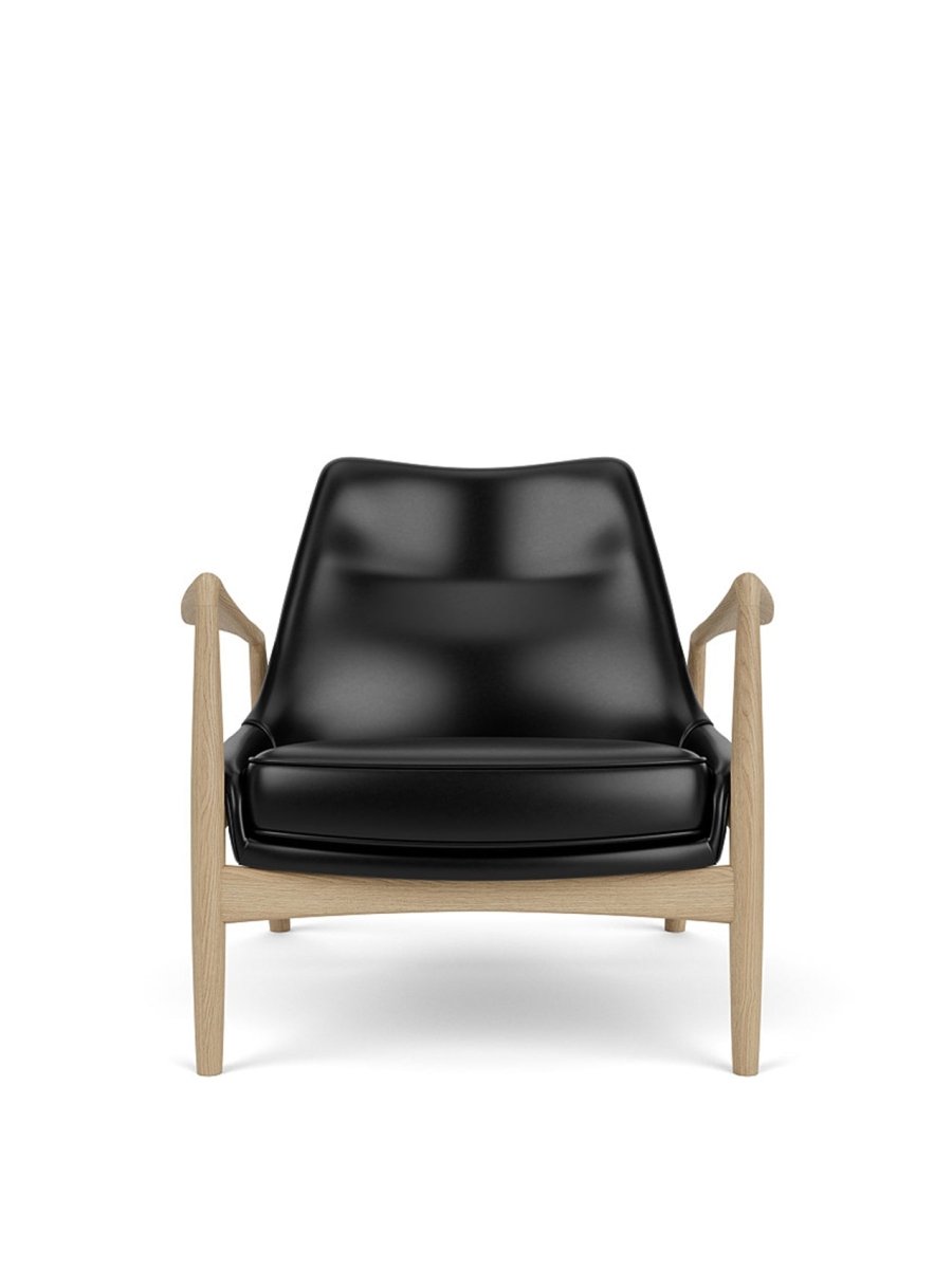 Front view of The Seal Lounge Chair, Low Back, upholstered in black leather with a natural oak frame.