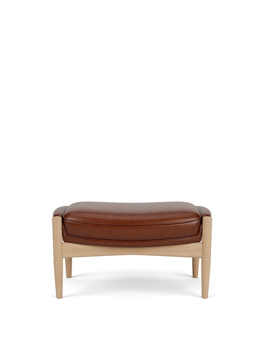 Front view of The Seal Ottoman in natural oak with brown leather upholstery, set against a plain white background.