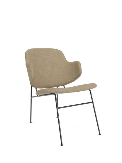 An angle view of The Penguin Lounge Chair, Fully Upholstered in light brown textured fabric with a slender black steel frame.
