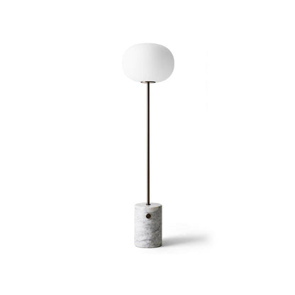 JWDA Floor Lamp featuring a white marble base, slender bronzed brass stem, and elliptical opal glass shade.