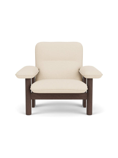 Front view of the Brasilia Lounge Chair with cream bouclé upholstery and a dark stained oak frame.