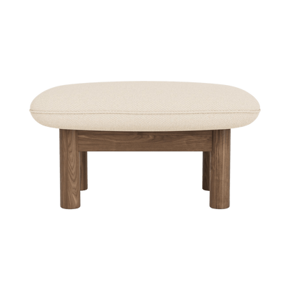 Brasilia Ottoman with light cream textile upholstery and a sturdy dark walnut frame, shown from a front view.