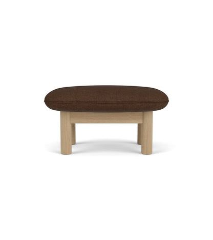 Brasilia Ottoman in brown Audo Bouclé 07 upholstery, featuring a sturdy natural oak frame seen from the front.