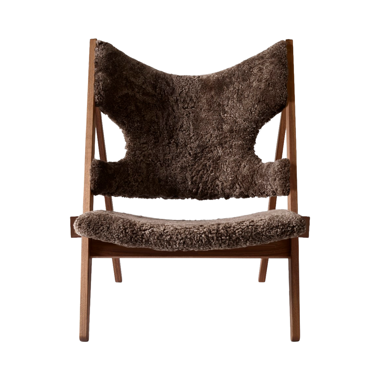 Front view of the Knitting Chair in solid walnut with luxurious root brown sheepskin upholstery.