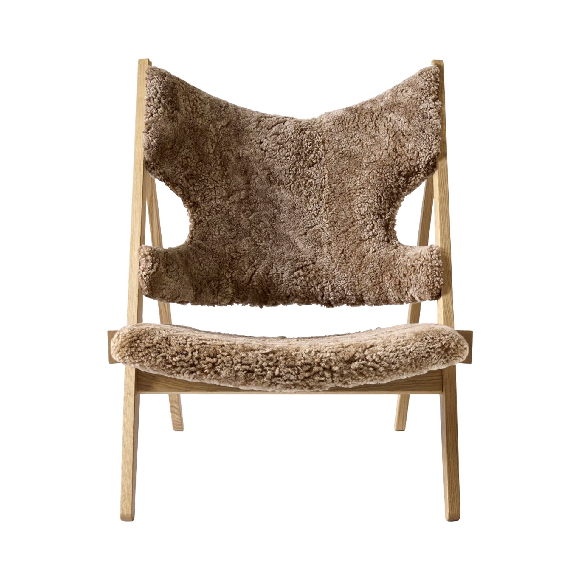 Front view of the Knitting Chair with natural oak frame and Sahara sheepskin upholstery.