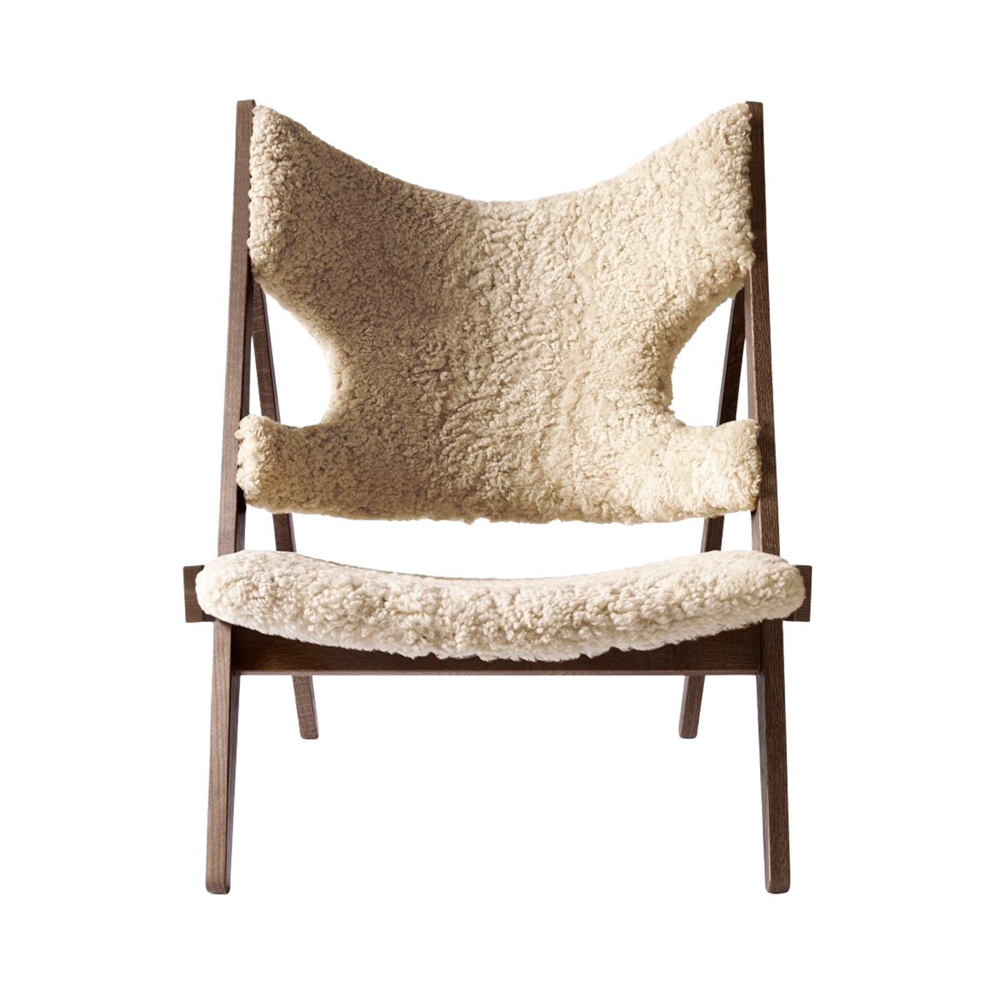 Front view of the Knitting Chair with dark-stained solid oak frame and luxurious natural-coloured sheepskin upholstery.