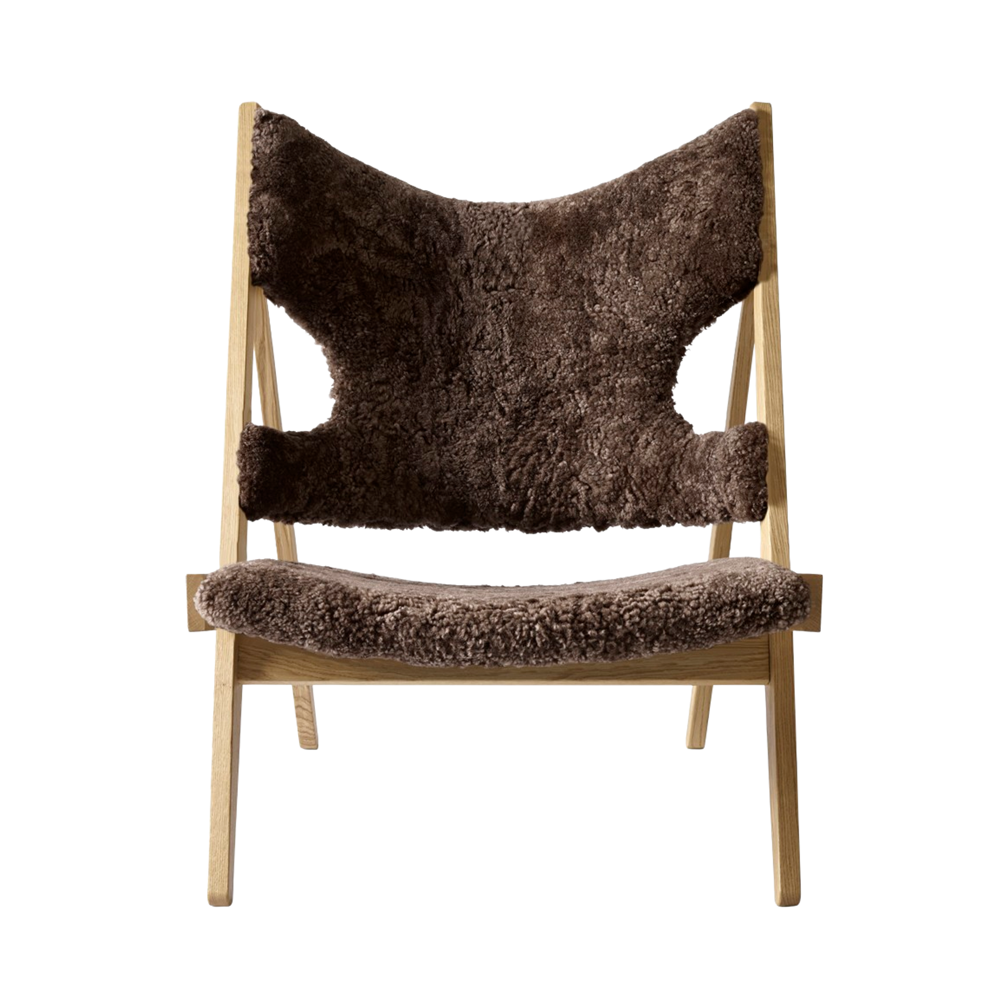 Front view of the Knitting Chair with root brown sheepskin upholstery and a natural oak wooden frame.