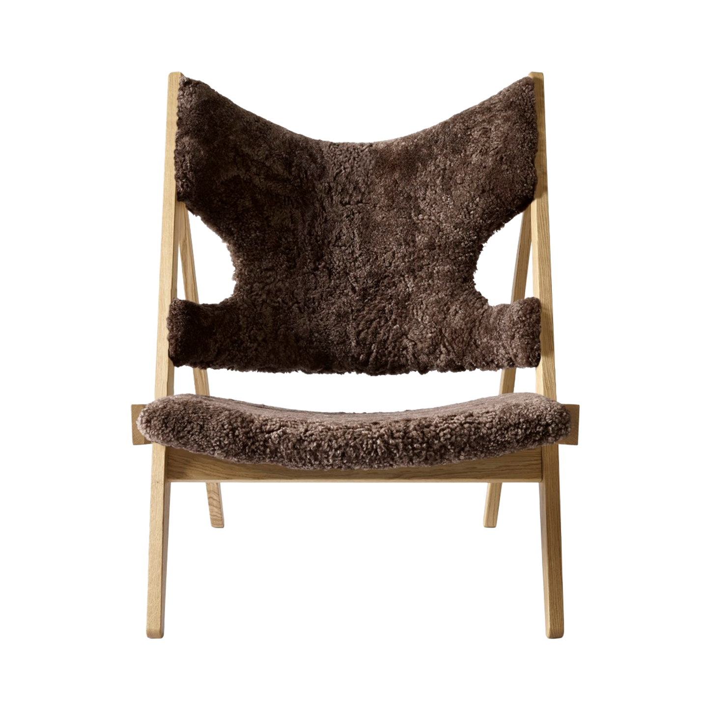 Front view of the Knitting Chair with root brown sheepskin upholstery and a natural oak wooden frame.