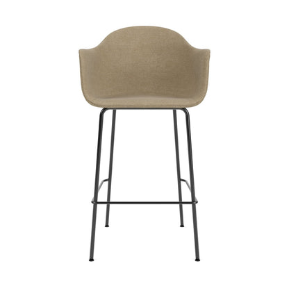 Front view of the Harbour Arm Chair, Bar Height, featuring beige bouclé upholstery and a slender black steel base.