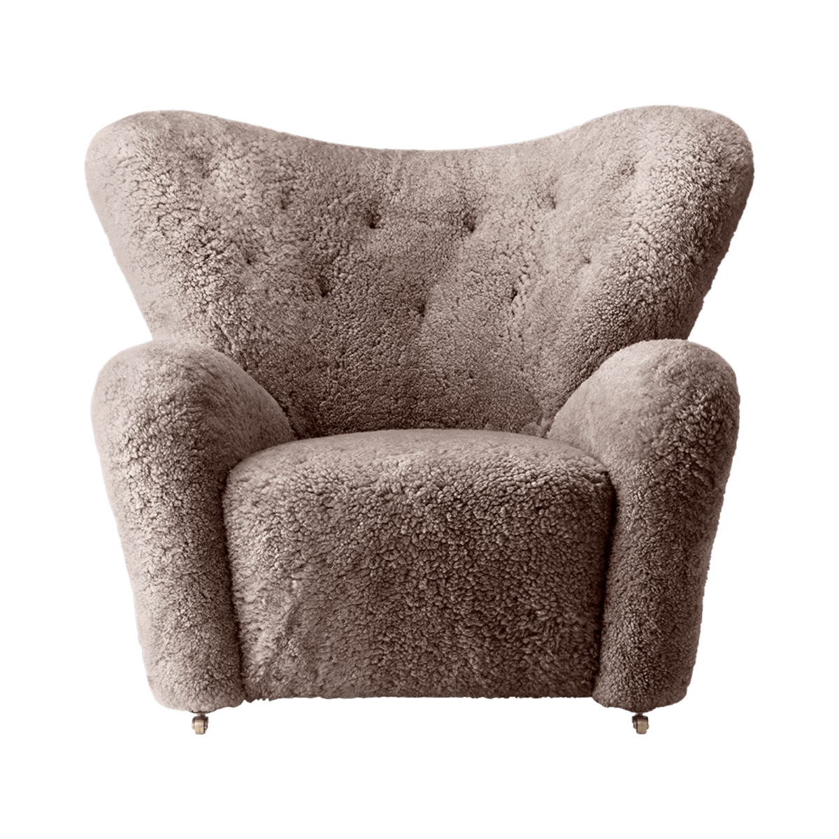 The Tired Man Lounge Chair in beige sheepskin with a tufted backrest and wooden legs with brass casters.