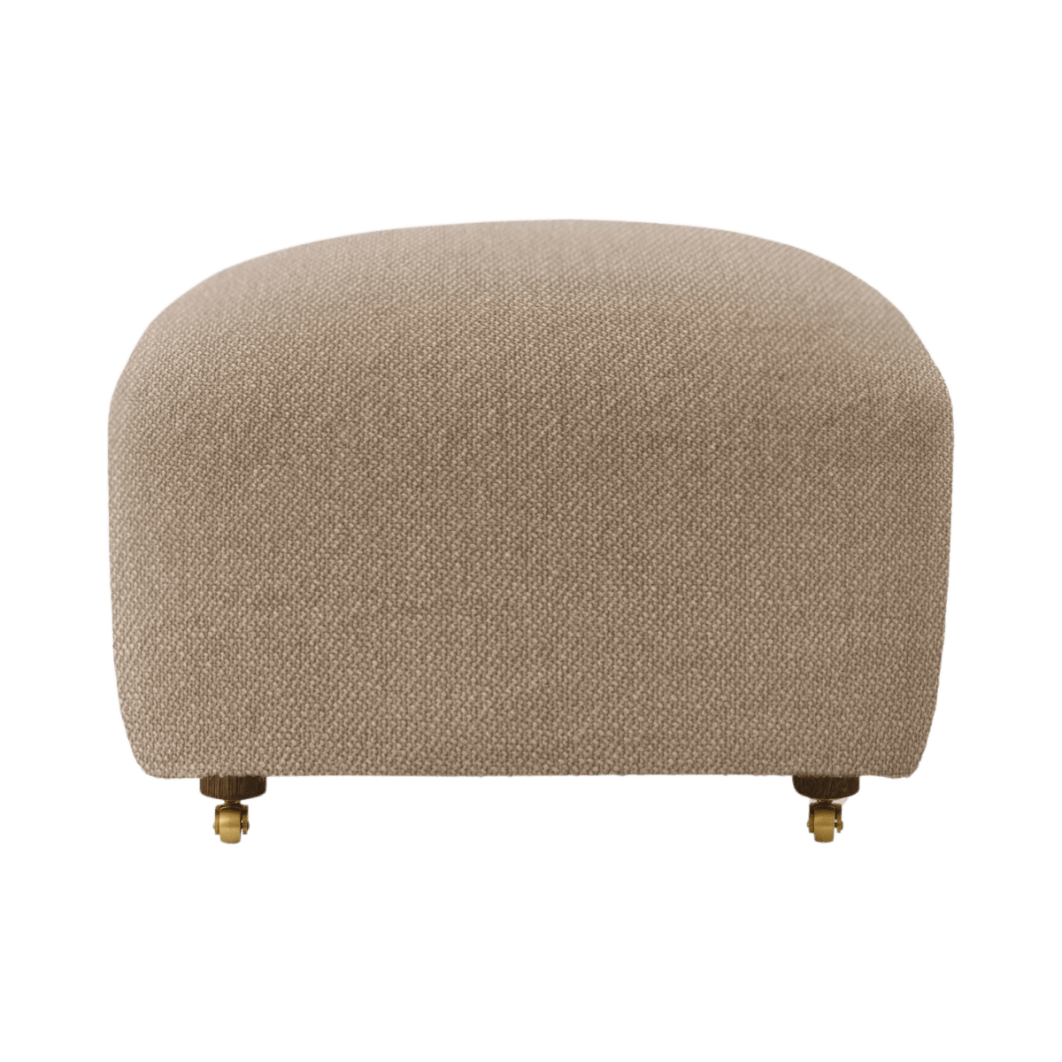 The Tired Man Ottoman upholstered in textured beige fabric with small wooden legs and brass castor wheels.