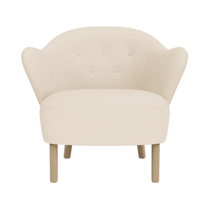 Front view of the Ingeborg Lounge Chair in Logan Jasmine textile with natural oak legs against a plain background.