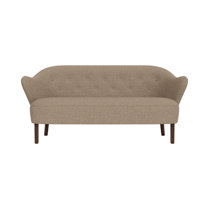 Ingeborg Sofa upholstered in Logan Flint textured fabric with smoked oak legs, shown from the front.