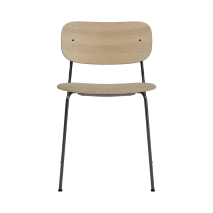 Co Dining Chair featuring a natural oak backrest and beige bouclé seat on a slim black powder-coated steel frame.
