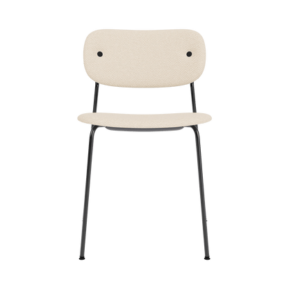 Co Dining Chair, Without Arms, fully upholstered in light Logan Jasmin fabric with a minimalist black steel frame.