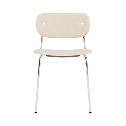 Co Dining Chair without arms, fully upholstered in cream Logan Jasmin fabric with a polished chrome frame, front view.