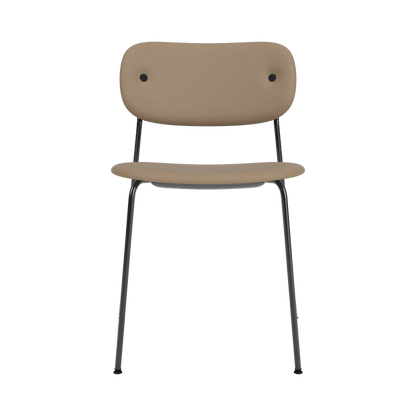 Front view of the Co Dining Chair, Without Arms, featuring tan Sierra upholstery and a slender black steel frame.