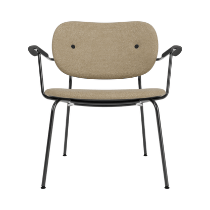 Fully upholstered Co Lounge Chair in beige Audo Bouclé 02 with black painted oak armrests and a slim steel frame.