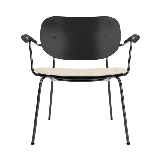 Co Lounge Chair with a black painted oak backrest and Logan Jasmin upholstered seat on a slender black steel frame.