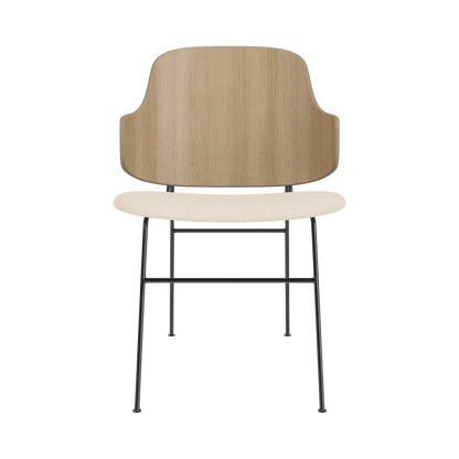 Front view of The Penguin Dining Chair with a natural oak back and Logan Jasmine upholstery on a black steel frame.