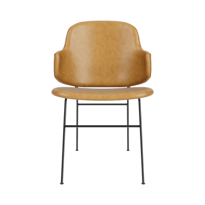 The Penguin Dining Chair, Fully Upholstered in tan leather, shown from the front with a slim black steel frame.
