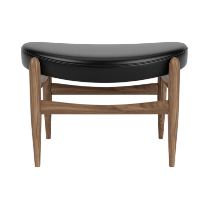 Front view of the Elizabeth Ottoman with wooden legs and dark upholstered seat, showcasing its classic design.