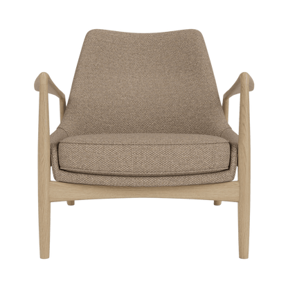 Front view of The Seal Lounge Chair, Low Back, featuring a natural oak frame and Logan Flint upholstery.