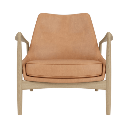 Front view of The Seal Lounge Chair, Low Back, upholstered in dunes camel leather with a natural oak wooden frame.