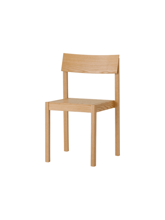 Natural oak Mauro Dining Chair with a minimalist veneer seat and curved backrest, shown from a three-quarter angle.