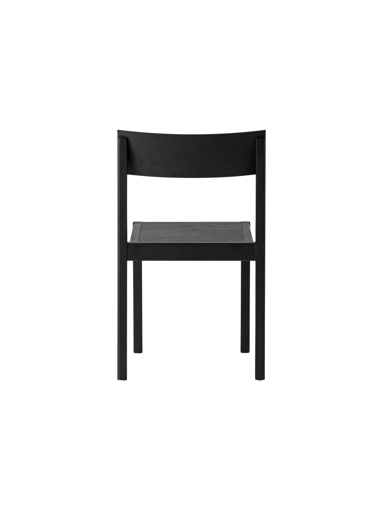 Black Mauro Dining Chair seen from behind, highlighting its solid oak frame and curved wooden backrest.