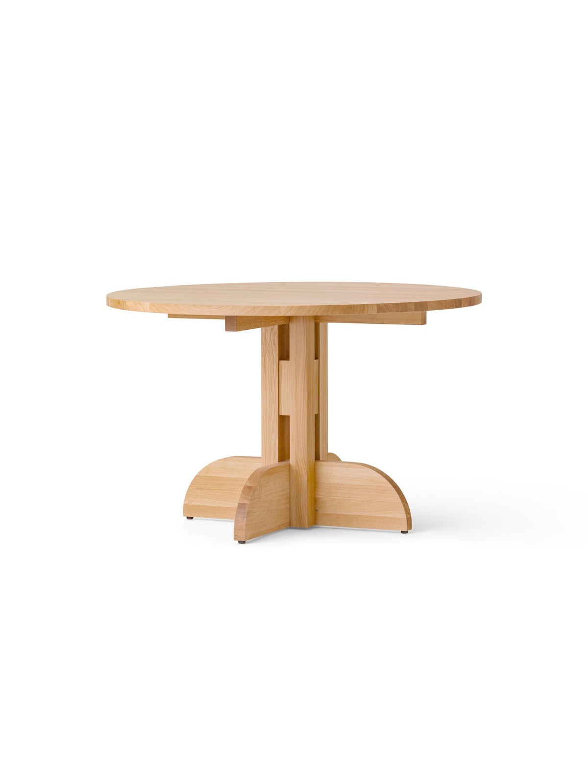 Round light oak dining table with cross-shaped pedestal and curved base feet, minimalist Danish design.