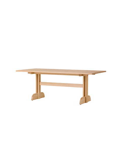 Rectangular Puffin Dining Table in natural oak, featuring a solid oak base and clean, Shaker-inspired design details.
