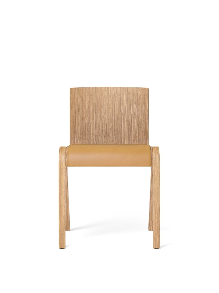 Front view of the Ready Dining Chair, Partially Upholstered in natural oak with a tan leather seat.