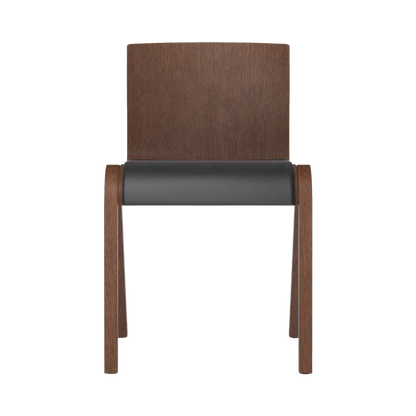 Front view of the Ready Dining Chair in red stained oak with a dark Dakar 0842 leather upholstered seat.