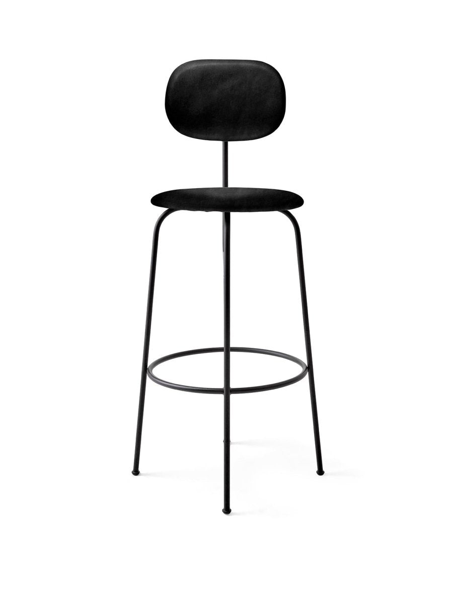 A black Afteroom Bar Chair Plus with a fully upholstered seat and back in Dakar leather, on a slender black steel frame.