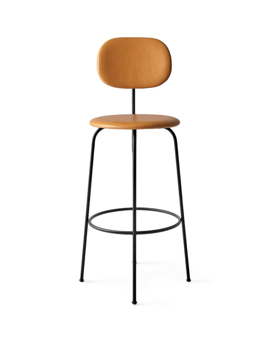 A front view of the Afteroom Bar Chair Plus, featuring a tan Dakar leather seat and backrest on a slender black steel frame.