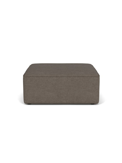 A front view of the Eave Sectional Pouf, a rectangular ottoman upholstered in a dark, brownish-grey textured bouclé fabric.